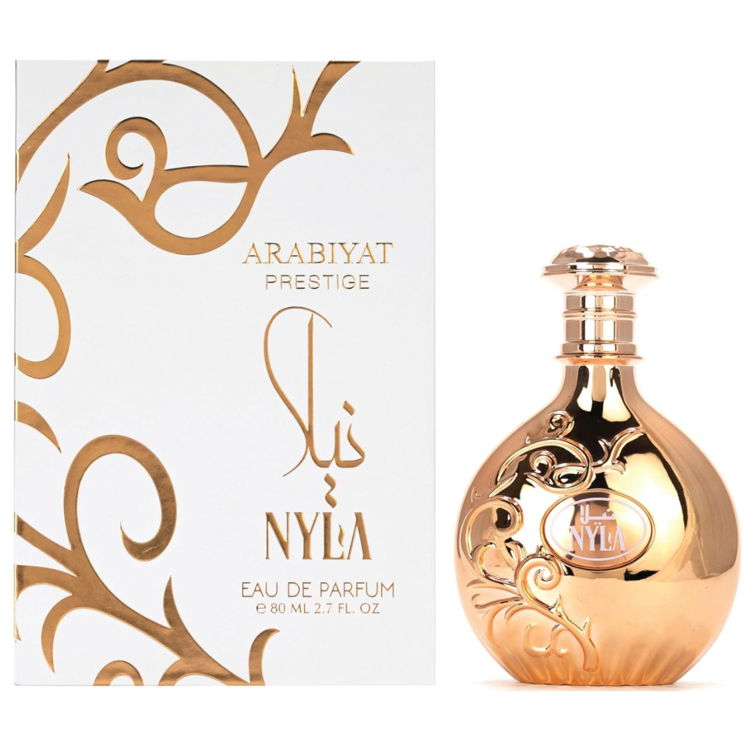 Gold perfume bottle and packaging with 'Arabiyat Prestige' branding on a white background