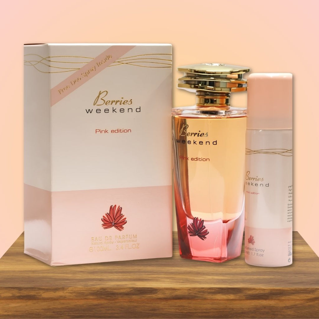 Perfume set with 'Berries Weekend' packaging on a wooden surface