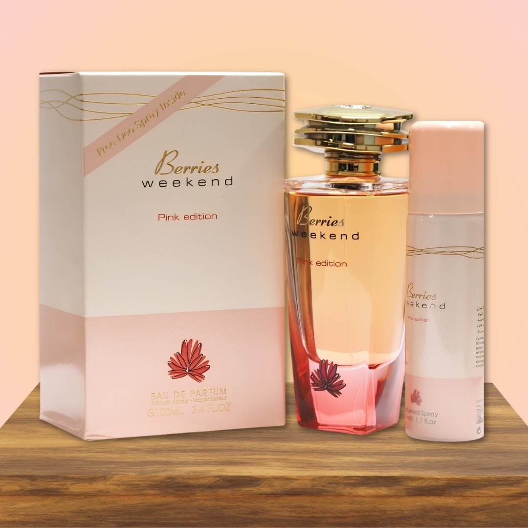 Perfume set with 'Berries Weekend' packaging on a wooden surface