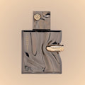 Ghost spectre Perfume bottle with gold accents on a beige background