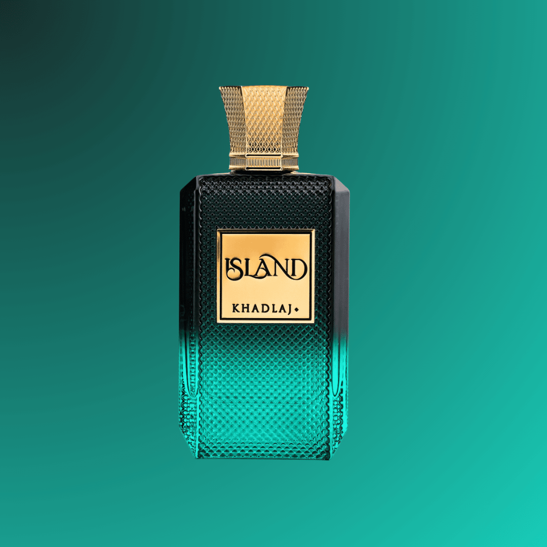 Perfume bottle with gold cap and 'Island Khadlaj' label on a teal background