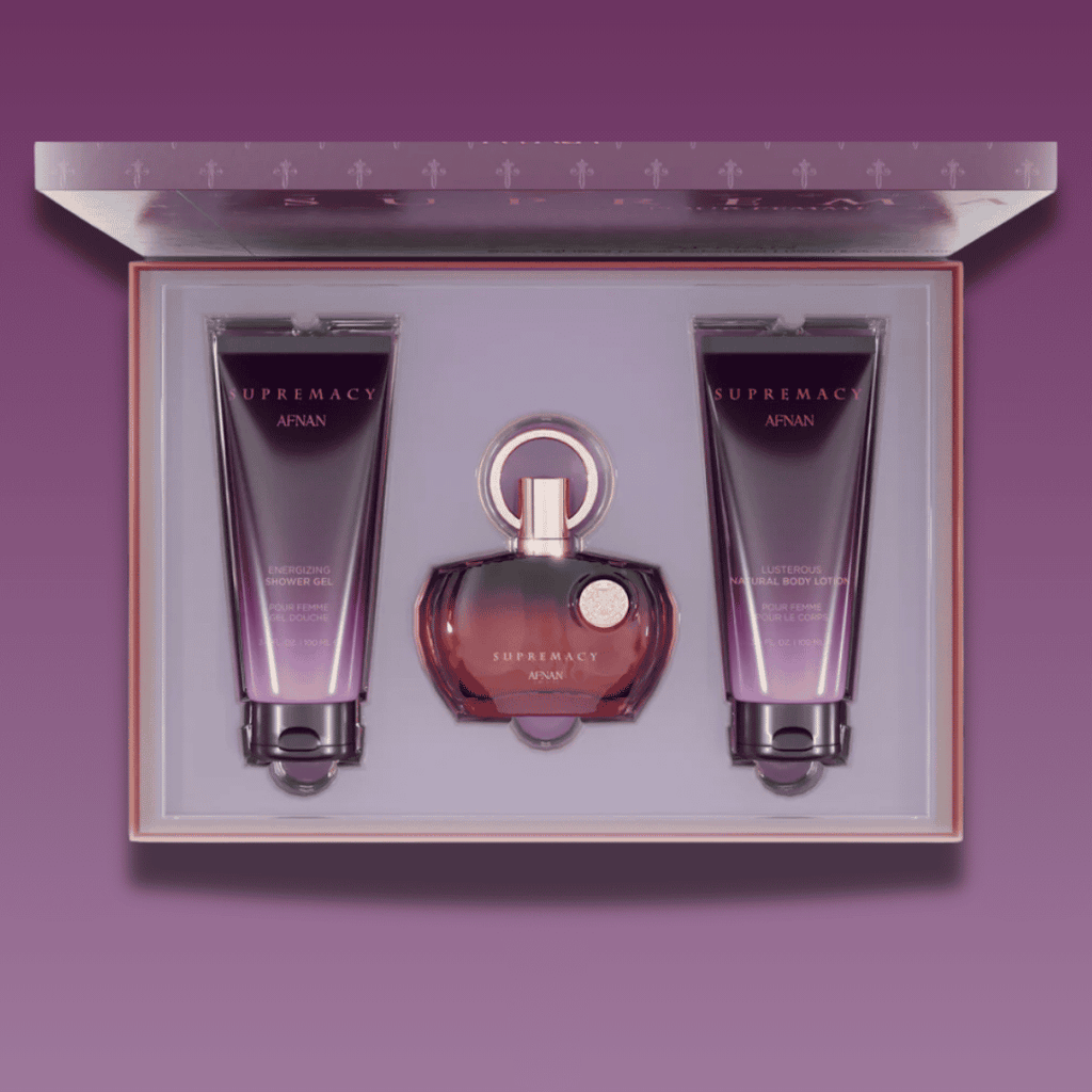 Afnan supremacy purple pour femme Perfume gift set with 100ml perfume, body lotion and shower gel in  a box on a purple background