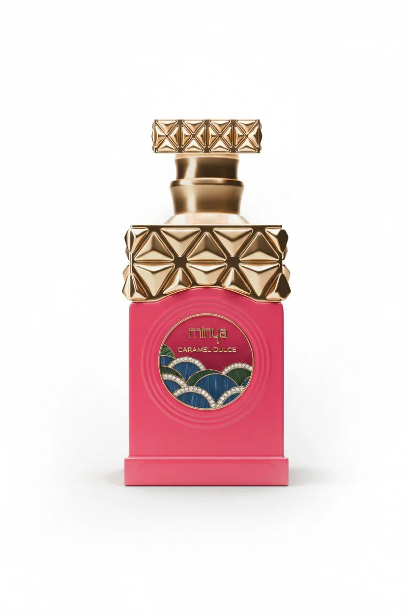 Pink perfume bottle with gold geometric cap, labeled Minya Caramel Dulce, on white background